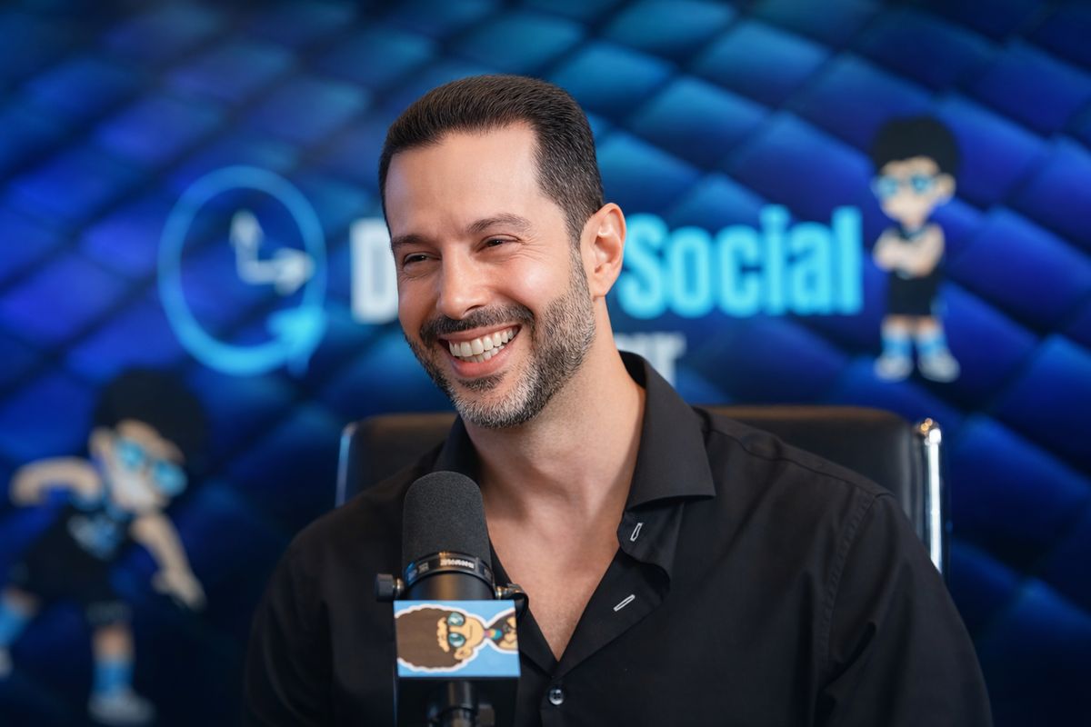 Ross Franklin speaking into a microphone during a Digital Social Hour studio interview